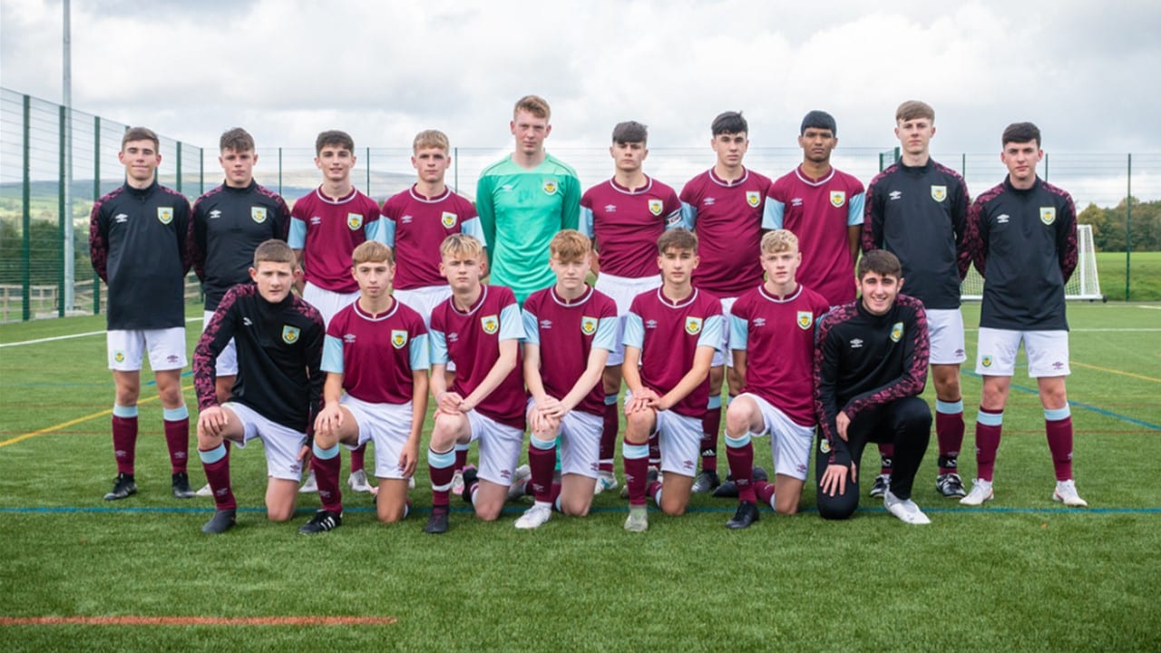Level 3 Burnley FC Shadow Youth Team, two rows of young men in their Burnley FC shirts